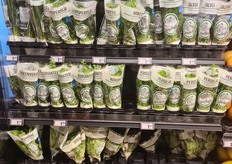 Lots of cut and potted herbs, with a few packaged lettuces.