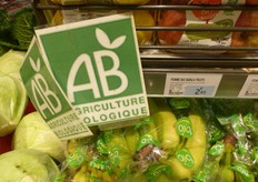 The organic bananas are packaged in plastic.