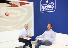 Coen Klok of the Spanish soft fruit producer Surexport, left, in conversation with a customer.