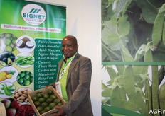 Isaac M. Muigou from Signet with avocados. This Kenyan company also exports various exotics, including the Hass avocado.