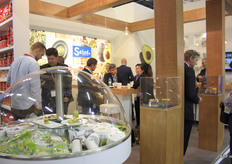 Clients coming and going at the Salud Food Group stand.