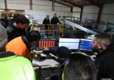 Visitors taking a look at the new blemish detection software as part of the Fruscan S7 Pro.