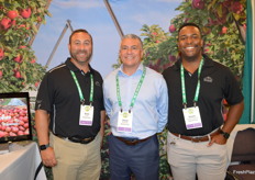 Brett Levy, David Armenta, and Shawn Santomassimo with Rainier Fruit. 
