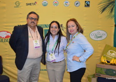 Alberto Pena, Audee Rios, and Aracely Van Dine with Coliman have organic bananas and papayas on display in their booth.