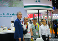 A festive photograph at the booth of Reemoon Sorting Technoloy where a new contract was signed.