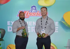 Hector Soltero and Ryan Cherry with Mission Produce. Hector shows avocados from Mexico while Ryan shows mangos from Brazil.