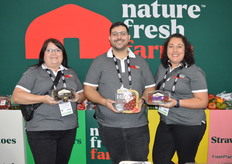 Pam Cherwak, Khalil Issa, and Zanelle Hough with Nature Fresh Farms show different greenhouse grown tomato products. From left to right the company’s recently launched Yoom tomato, Hirros that were introduced earlier this year, and organically grown greenhouse grown strawberries.