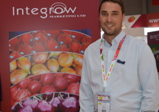 Angus Curry from Integrow with apples, onions, cherries and Piqu Boo pears.