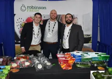 Team Robinson Fresh has a variety of produce items on display. Smiling for the photo are Kyle McDevitt, Austin Ley, and Anthony Labetti.