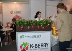 Jenny Woo was at the K-Berry stand with pink and red strawberries.