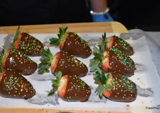 Chocolate covered strawberries and a hint of camo in the booth of North Bay Produce.