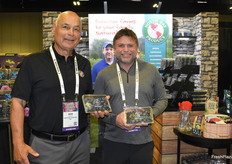 Rod Bangert and Ryan Lockman proudly show jumbo blueberries.