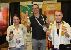 Cold pressed juices in the booth of Suja Life. From left to right: Juliet Moran, Jody Cnossen, and Nikki Simmons.