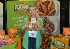 Bailey Slayton with Bako Sweet proudly shows organic sweet potatoes.