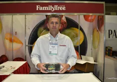 Doug Ensz with Family Tree Farms proudly shows jumbo blueberries from California.