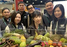 The Van-Whole Produce team behind a colorful assortment of tropical and exotic produce.