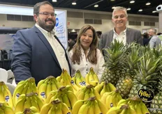 Justin Heffernan, Ahiby Rodriguez and Juan Alarcon with Fyffes North America behind their display of bananas and pineapples.
