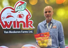 Stephen Van Meekeren with Van Meekeren Farms holding its newest apple, the Honeymoon apple.
