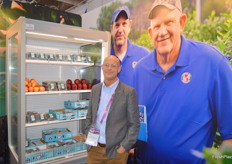 Eric V. Olshove export sales Manager from North Bay Produce with their display fridge of fruit.