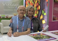 Shirley & Stan Chapman distributing 3rd annual GPFS poster in Village Farms Greenhouse Grown booth.
