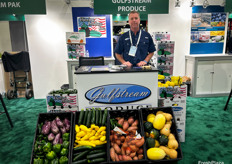 Craig proudly shows an array of produce at Gulfstream Produce’s booth.