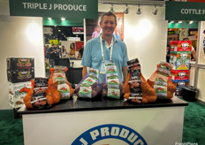 Joey Hocutt of Triple J Produce with an array of sweet potatoes.