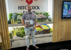 Shane Moreno of Hitchcock Farms shows off the company’s purple Brussels sprouts.