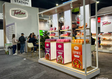 Colorful tomatoes on a cleanly designed display for Westmoreland Sales-Topline Farms.