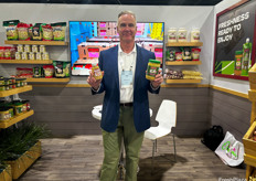 Joe Cardi of Garland, LLC holds the garlic goods.