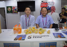 Ken Sugimoto (right) with mandarins from Japan.