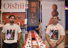 Jack Kissinger and Tony Stancampiano with Ooishii give show attendees an opportunity to try two different types of strawberries.