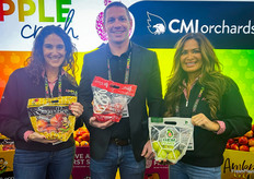Lots of tree fruit was on display at CMI Orchards' booth. L-R: Danelle Huber, Loren Foss and Ellie Tucker.