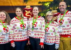 Festive times at the Snapdragon and Rubyfrost Apples booth. L-R: Jessica Wells, Jackie Hampton, Phoebe Walsh, Elizabeth Coene and David Coene.