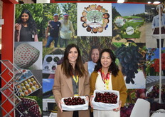 Sarah Bistritz and Kim Hoang with World Fresh Exports have beautiful, large cherries from Tasmania on display.