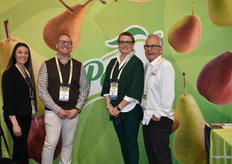Sage Brinkman and Justin Bloss of Rivermaid Trading in the booth of USA Pears with CarrieAnn Arias and Bob Catinella.