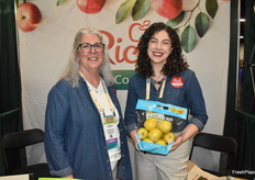 Brenda Briggs, and Kristi Kraft with Rice Fruit Company, showing Lemonade apples.