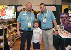 Craig Fields and Drew Callaghan of Grimmway Produce / RPE are joined for a photo by Crewe Fields, who loved the blue water slide best.