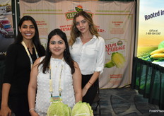 Eliza Rojas from Farm Fresh Produce is flanked by Catalina and Anna.