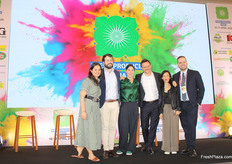 Fruitnet representatives share a proud moment on stage at the closing ceremony.