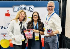 Sara Storm (L) of FirstFruits Farms visits with Nicole Finelli and Michael Schadler, both of the Washington Apple Commission.