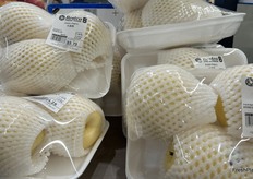 Asian pears sold three to a tray.