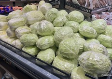 Wrapped sizable heads of cabbage.