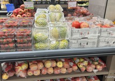 Strawberries, Toucan papayas, pomegranates and apples–fruits that don’t often share shelf space right beside each other.