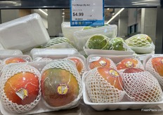 Sun mangoes sold in pairs.