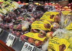 On the other side of the loose apples are bags of apples, including the store’s value Naturally Imperfect brand.
