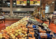 Canadian onions and carrots on sale.