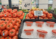 Much like the apples and Brie cheese, hothouse tomatoes are shelved next to containers of fresh mozzarella.