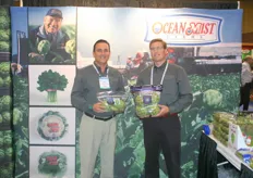 Bob Polovneff and Brian Hawes of Ocean Mist presenting new bags with instructions of how to prepare the vegetables on the backside.