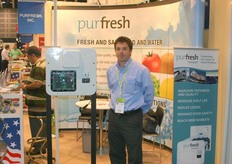 Adam Valmoro of Purfresh standing next to a ozone system for ocean container shipments.