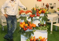 Tamir Basson of Zeraim stands proudly in his booth. A lot of visitors come to their booth to eat a sample of soup.
